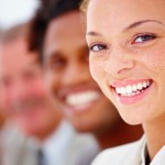 Portrait of a smiling business woman and workmates